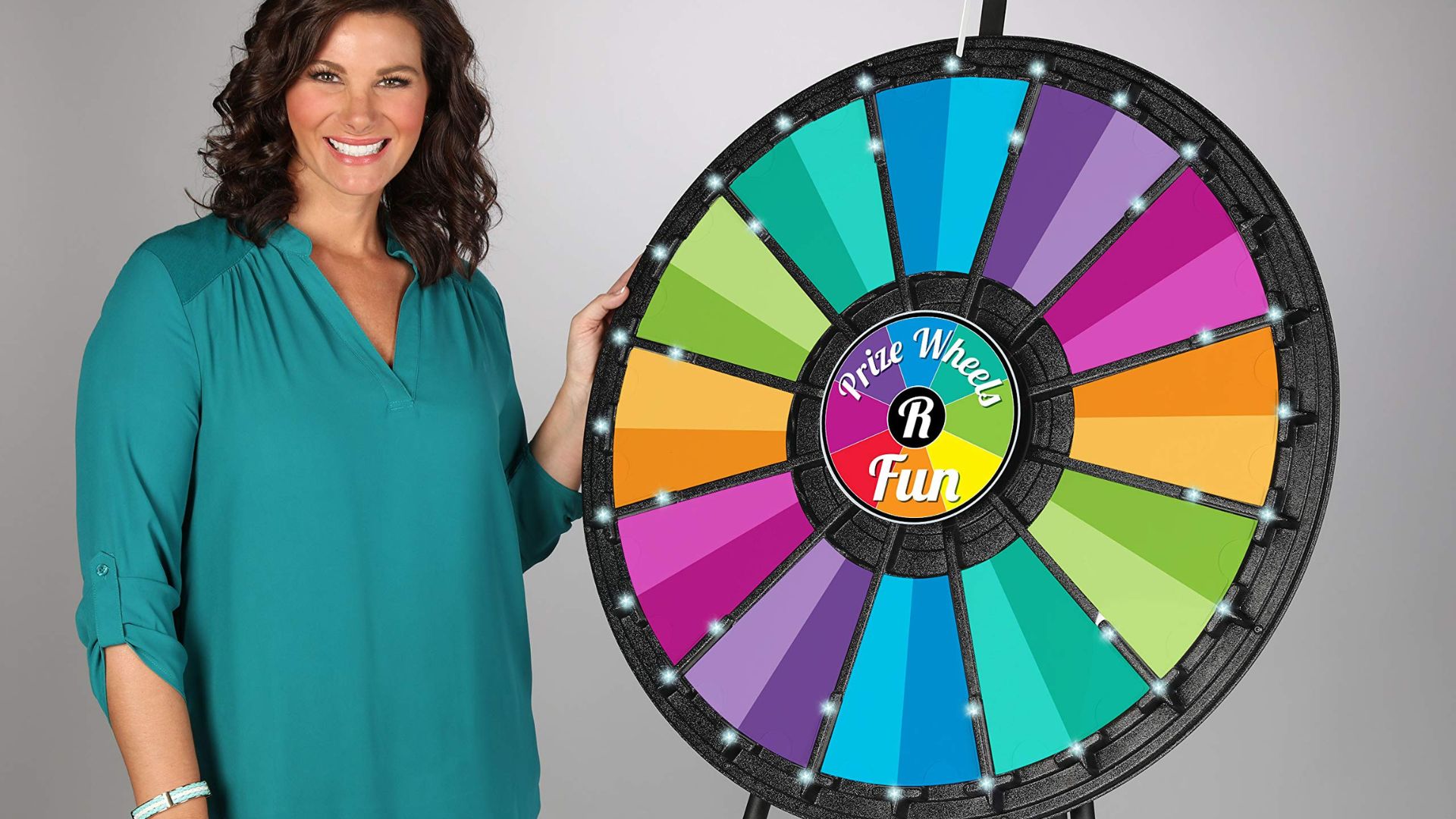 A lady holding a Spin Wheel for Trade Shows